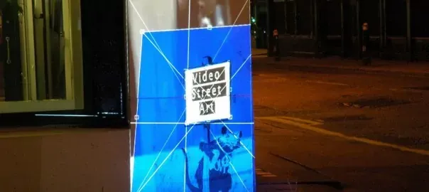 London Video Street Art showing projected moving image mapped onto existing graffiti in an urban night-time setting.